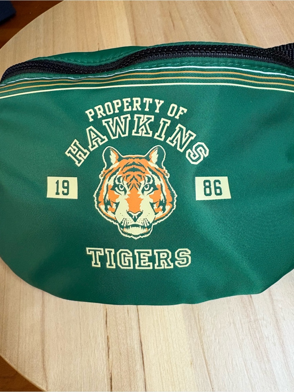 limited-edition MAC Cosmetics x Stranger Things Hawkins Tigers waist bag,